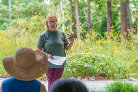 curator explaning plants curator explaning plants